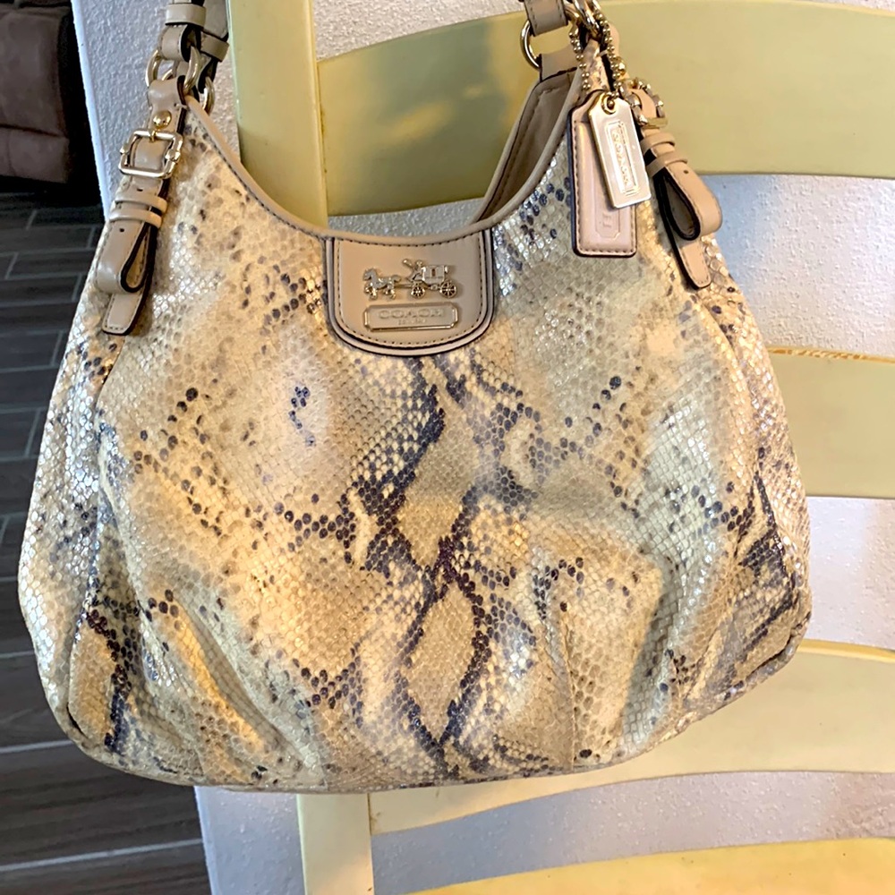 Coach Purse: snake-like print with pale purple interior.